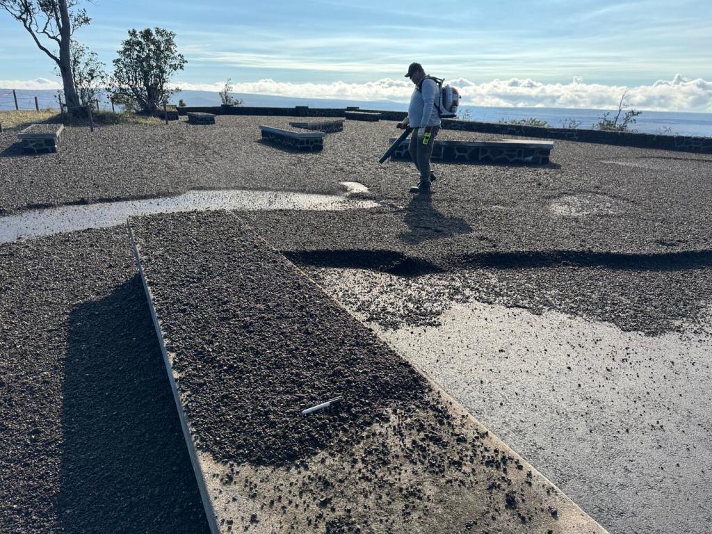 Worker cleaning up ash from a platform at the Jaeggar Museum on Kīlauea in Hawai'i on January 25, 2026. Credit: USGS/HVO.
